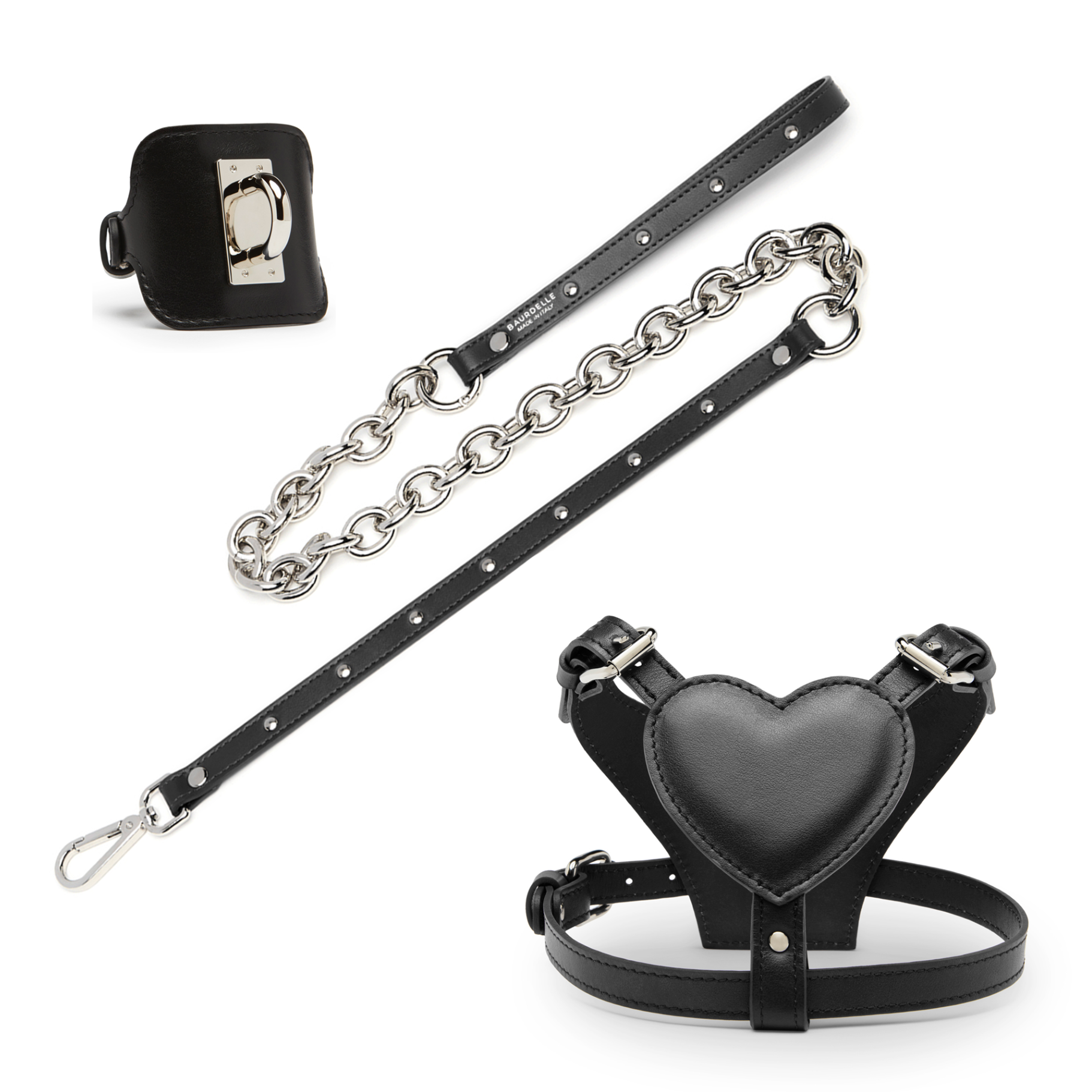 Set per cani di piccola media taglia in pelle di colore nero, composto da guinzaglio con catena, pettorina a forma di cuore e polsino.